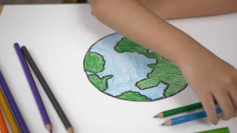 Kid save the earth. Close up kid colored earth on white paper. Stockbeeldmateriaal 232941308