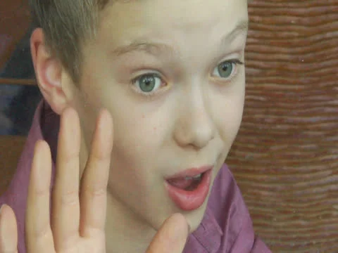 The Kid is saying goodbye to someone Stock Footage 22918860
