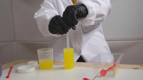 Kid in scientific costume doing a experiment Stock Footage 280684846