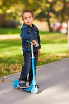 Kid with scooter 스톡 사진