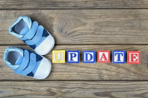 Kid shoes and word update Stock Photos