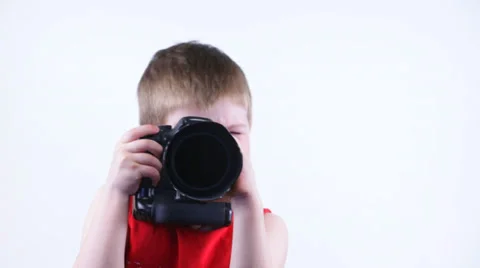 Kid shoots at the camera and smiling Stock Footage 37204114
