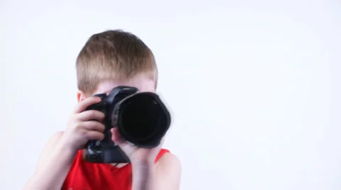 Kid shoots at the camera and smiling Stock Footage 37204136