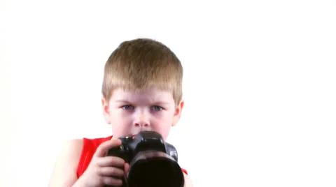 Kid shoots at the camera and smiling 스톡 동영상 37204262