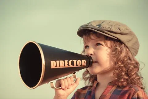 Kid shouting through megaphone Stock Photos