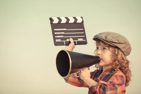 Kid shouting through megaphone Stock Photos