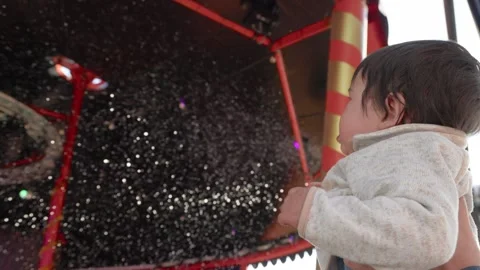 Kid at the show looks at the soap bubbles Stock Footage 244635228