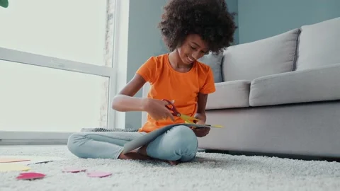 Kid sit couch cut scissors carton present handcraft 8-march heart indoors Stock Footage 168751136