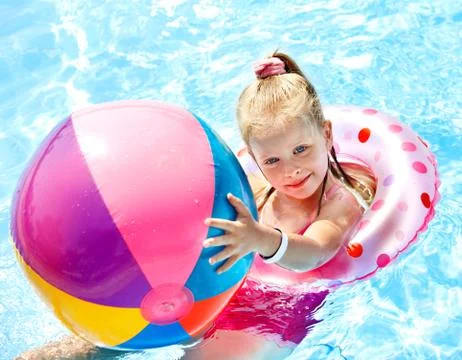 Kid sitting on inflatable ring. Stock Photos