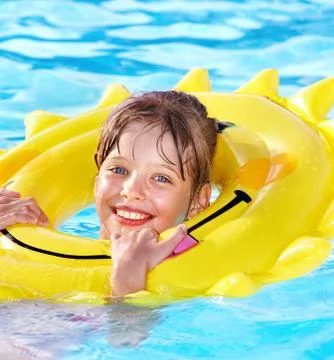 Kid sitting on inflatable ring. Stock Photos