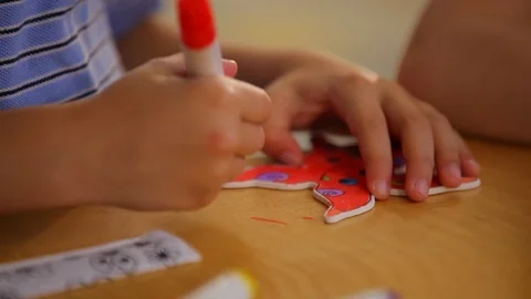 Kid sitting at a table drawing coloring arts and crafts Stock Footage 106949267