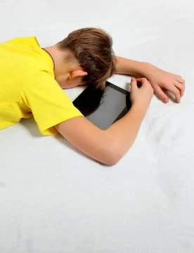 Kid sleep with Tablet Computer Foto stock