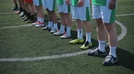 Kid Soccer Players Aligning On The Center On Green Artificial Turf Stock Footage