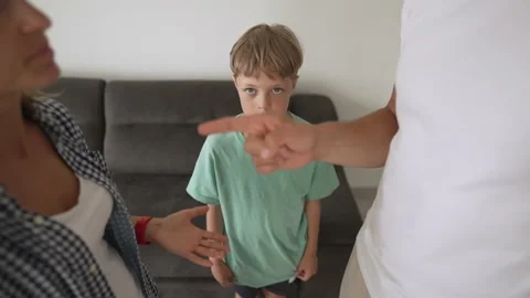 Kid son feels upset while parents fighting at background, sad little girl Stock-Footage 194989907