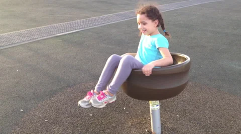 Kid spining on playground Stock Footage 32142192