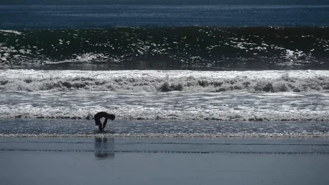 Kid standing in surf Stock Footage 126669534