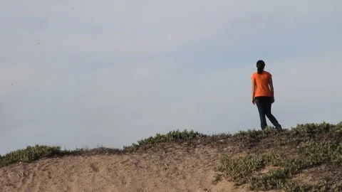 Kid stands on top of hill Stock Footage 113910553