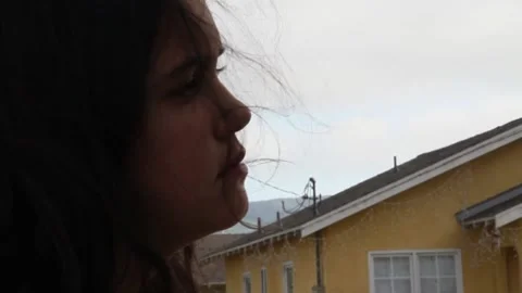 Kid staring at something then leaving Stock Footage 155386207