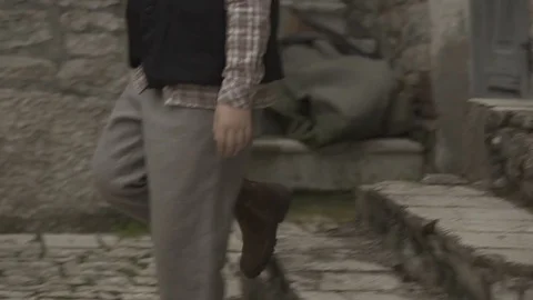 Kid start walking slow motion close up old style 1900's Stock Footage 71289823