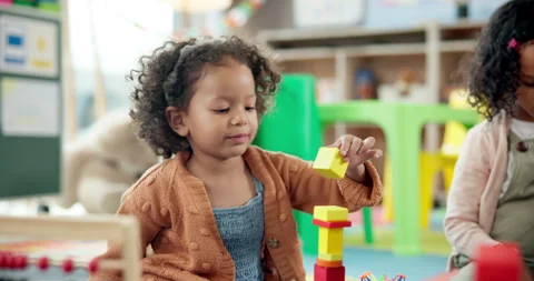 Kid, student and stack blocks in classroom for learning, problem solving and Stock Footage 306505802