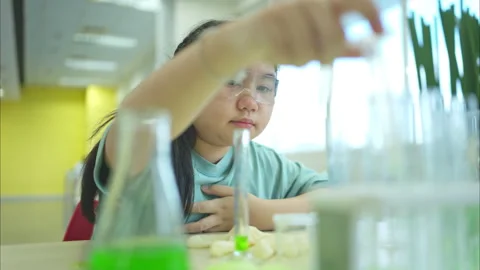 A kid student in a science project during a STEM class Video stock 320785035