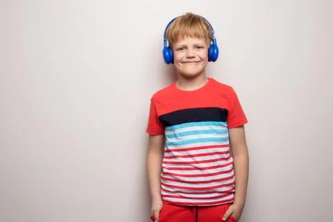 Kid Studio Shoot Using Headphone Listening Music. Isolated on white Stock Photos