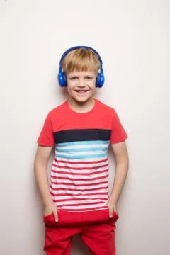 Kid Studio Shoot Using Headphone Listening Music. Isolated on white Stock Photos