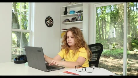 Kid studying mathematics on laptop during e-learning session. Student streaming Stock Footage 317376027