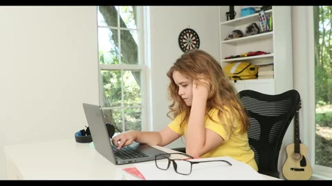 Kid studying mathematics on laptop during e-learning session. Student streaming Stockbeeldmateriaal 320864192