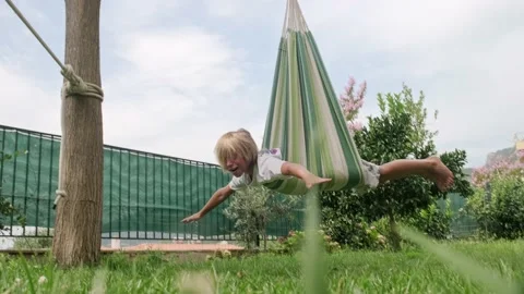 Kid swinging on hammock. Stock Footage 202519300