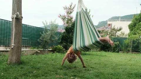 Kid swinging on hammock. Video stock 202720577