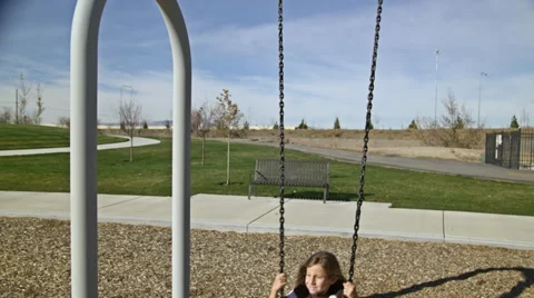 Kid swinging HD Stock Footage 32383275