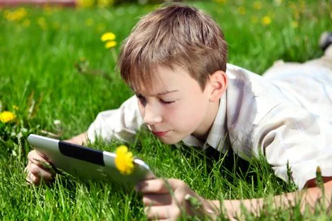 Kid with Tablet Computer Stock Photos