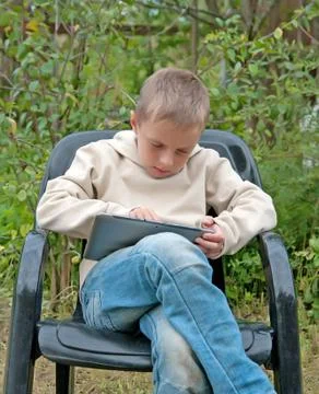 Kid with tablet pc. Stock Photos