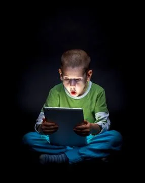 Kid with tablet Stock Photos