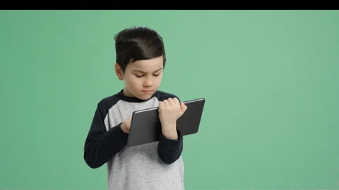 Kid taking notes playing tablet computer - Alpha Channel, Green Screen Stock Footage 129349326