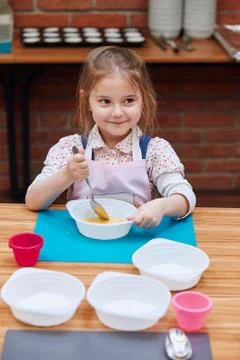 Kid taking part in baking workshop Stock Photos