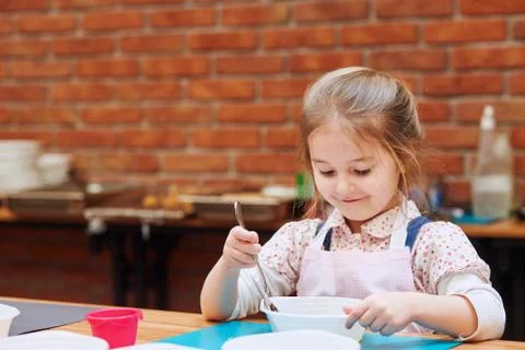 Kid taking part in baking workshop Stock Photos