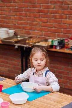 Kid taking part in baking workshop Stock Photos