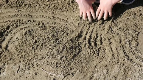 Kid taking sand in both hands and leaving Stock Footage 88597929