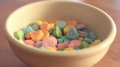 Kid Taking Valentine's Candy out of Bowl Stock Footage 34261653