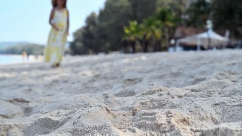 Kid throw away the plastic water bottle on beach, Stock Footage 127037333