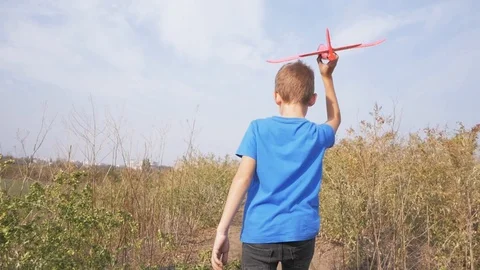 Kid with toy airplane Stock Footage 97365618