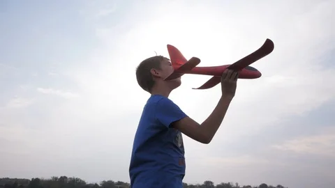 Kid with toy airplane Stock Footage 97365635