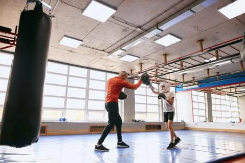 Kid training with personal instructor, preparing for competition Stock Photos