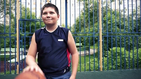 Kid training streetball Stock Footage 77151354