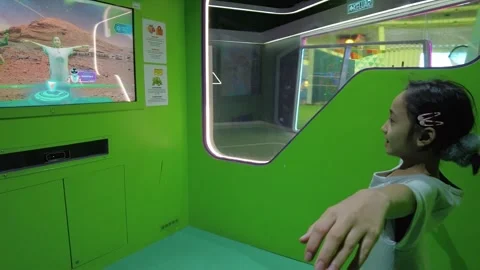 A kid is trying the interactive touch screen at the National Science Museum. Stock Footage 331982057