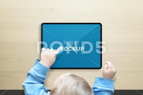 Kid use tablet mockup. Top view scene. Tablet in horizontal position Modello PSD