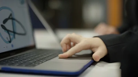 Kid using laptop computer to scribble Stock Footage 98904837