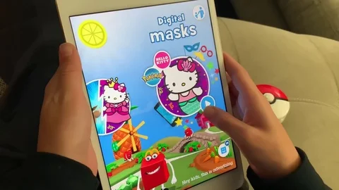 Kid using the Mc Donald's Mc Play app on his iPad device to scan his new Stock Footage 118653099